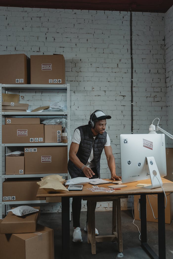 Crafting Captivating Headlines: Your awesome post title goes here A man in a warehouse packaging orders for shipping. E-commerce and business concept.